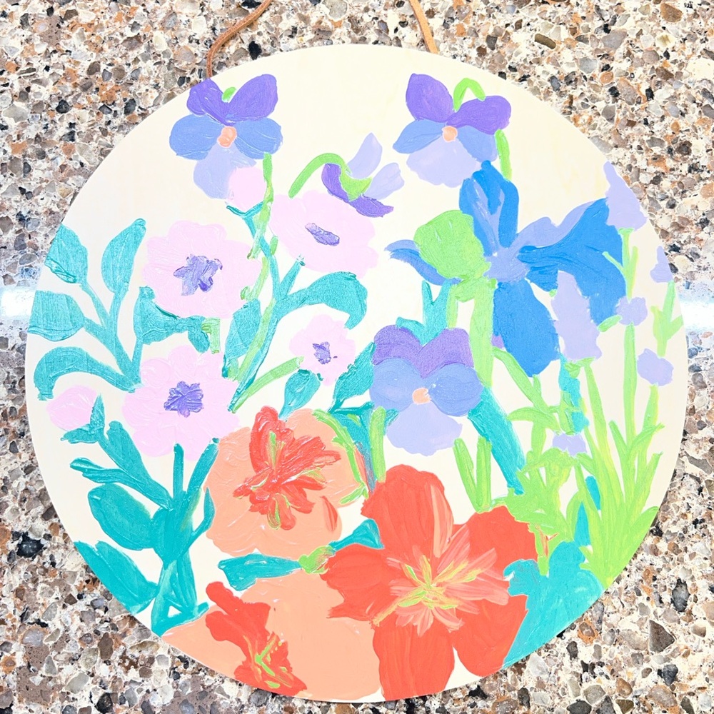 Hand painted by me round wood wall art plaque featuring purple pansy flowers
